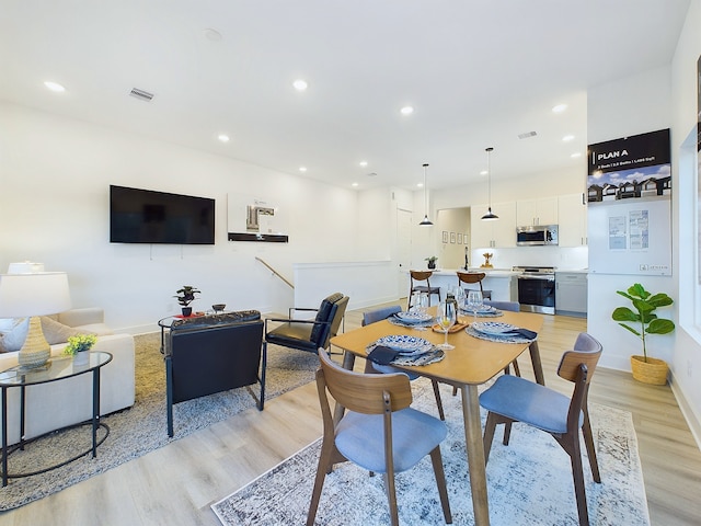 2710 Jensen Creek Ln, Houston, TX 77026 - dining space featuring light wood-style floors and recessed lighting