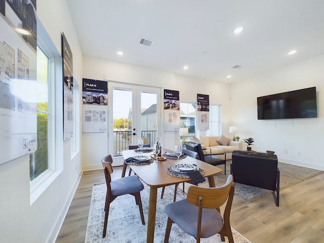2710 Jensen Creek Ln, Houston, TX 77026 - dining area featuring light wood-type flooring, recessed lighting, and french doors
