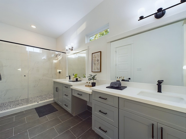 2710 Jensen Creek Ln, Houston, TX 77026 - bathroom featuring vanity, a marble finish shower, tile patterned flooring, and recessed lighting