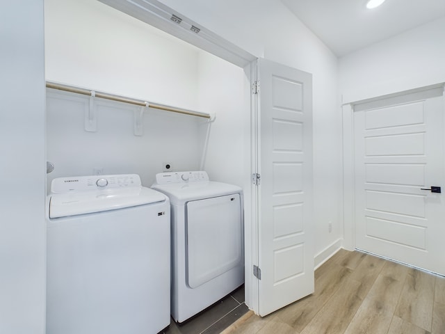 2710 Jensen Creek Ln, Houston, TX 77026 - laundry area with separate washer and dryer, light wood-type flooring, and recessed lighting
