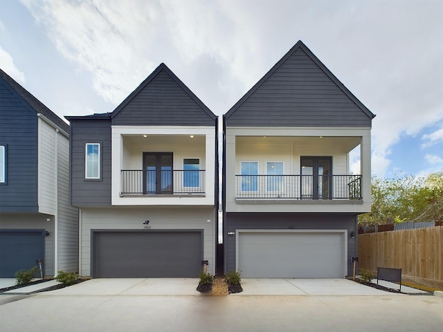2710 Jensen Creek Ln, Houston, TX 77026 - view of front of home featuring a balcony, a garage, and driveway