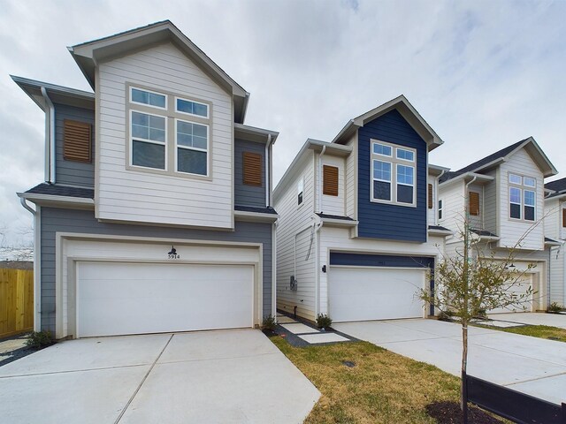 5914 Eastwood St, Houston, TX 77021 - view of front of house with an attached garage, concrete driveway, and fence
