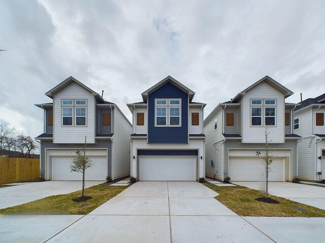5914 Eastwood St, Houston, TX 77021 - view of front of property with a garage, concrete driveway, and fence