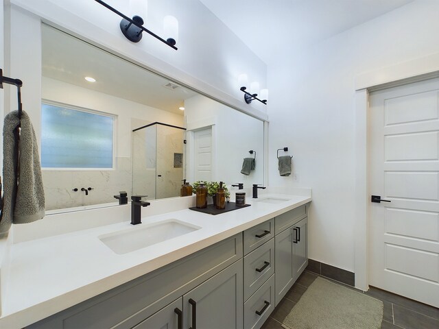 5914 Eastwood St, Houston, TX 77021 - bathroom featuring a stall shower, tile patterned floors, double vanity, and recessed lighting