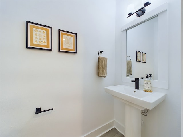 5914 Eastwood St, Houston, TX 77021 - bathroom featuring baseboards and wood finished floors