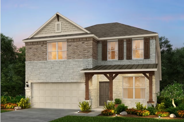 25701 Damask Dr, Magnolia, TX 77355 - view of front of house featuring a standing seam roof, a garage, driveway, and stone siding