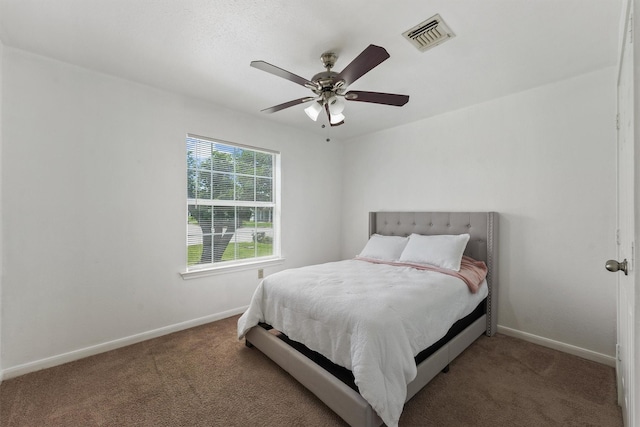 1314 Robert St, Baytown, TX 77521 - bedroom with carpet, baseboards, and ceiling fan