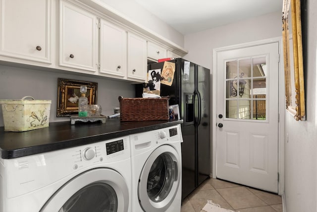 5610 Edgewick Ct, Houston, TX 77069 - laundry room with washer and dryer, light tile patterned floors, and cabinet space