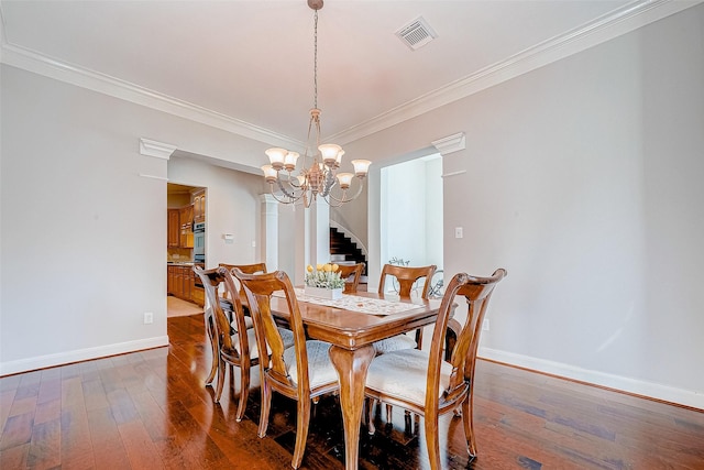 15614 Stable Brook Cir, Cypress, TX 77429 - dining space featuring a chandelier, baseboards, dark wood-style floors, ornamental molding, and stairway