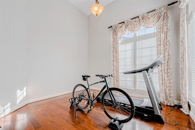 15614 Stable Brook Cir, Cypress, TX 77429 - workout area featuring hardwood / wood-style floors, baseboards, and lofted ceiling