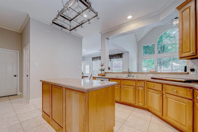15614 Stable Brook Cir, Cypress, TX 77429 - kitchen with a sink, light tile patterned floors, a kitchen island, light countertops, and ornamental molding