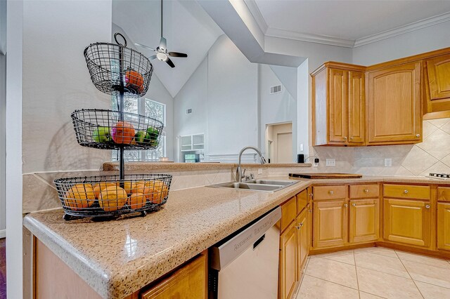 15614 Stable Brook Cir, Cypress, TX 77429 - kitchen featuring white dishwasher, a sink, ceiling fan, decorative backsplash, and light tile patterned floors