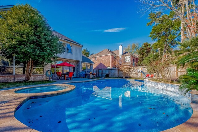 15614 Stable Brook Cir, Cypress, TX 77429 - view of pool featuring an in-ground hot tub, a fenced backyard, and a patio