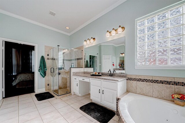 15614 Stable Brook Cir, Cypress, TX 77429 - bathroom featuring tile patterned flooring, vanity, ornamental molding, a shower stall, and a tub with jets