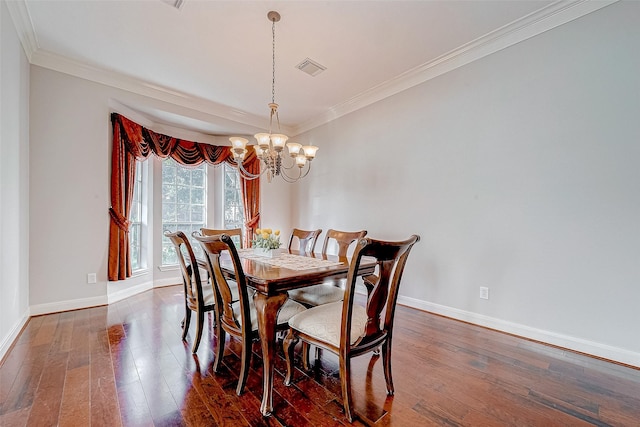 15614 Stable Brook Cir, Cypress, TX 77429 - dining room with a chandelier, baseboards, dark wood-style floors, and crown molding