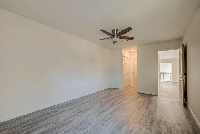 12632 Newbrook Dr, Houston, TX 77072 - empty room featuring wood finished floors, a ceiling fan, and baseboards