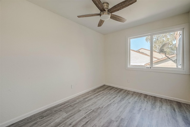 12632 Newbrook Dr, Houston, TX 77072 - unfurnished room featuring light wood-style floors, baseboards, and a ceiling fan