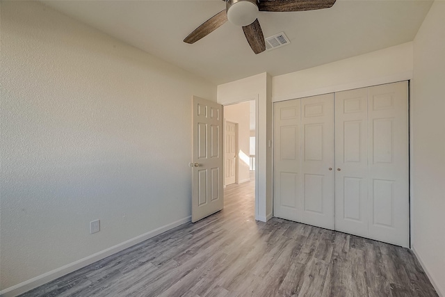 12632 Newbrook Dr, Houston, TX 77072 - unfurnished bedroom with wood finished floors, baseboards, a closet, and a ceiling fan