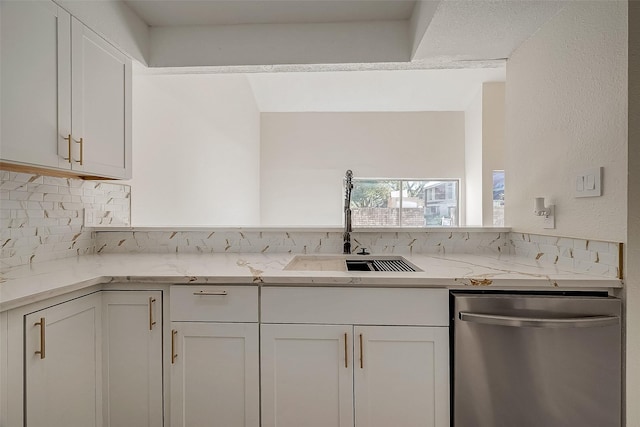 12632 Newbrook Dr, Houston, TX 77072 - kitchen featuring stainless steel dishwasher, a sink, tasteful backsplash, white cabinets, and light stone countertops