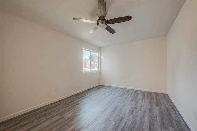 12632 Newbrook Dr, Houston, TX 77072 - spare room with dark wood-style floors, ceiling fan, and baseboards