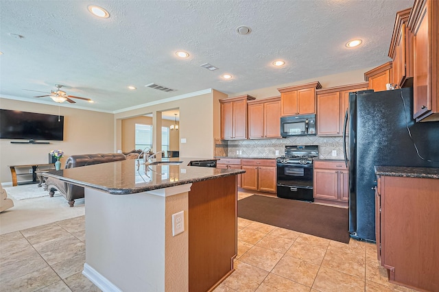5018 Longlane Dr, Houston, TX 77084 - kitchen featuring black appliances, a sink, a ceiling fan, dark stone countertops, and light tile patterned floors
