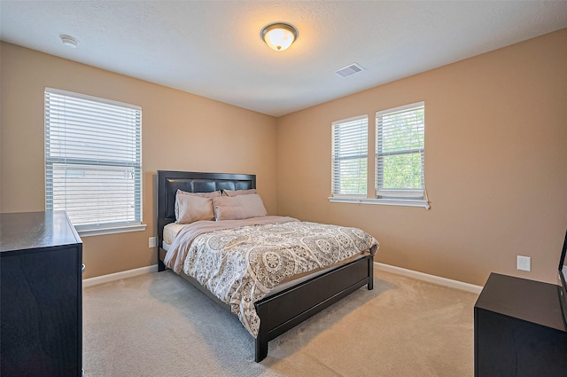 5018 Longlane Dr, Houston, TX 77084 - bedroom featuring light colored carpet and baseboards