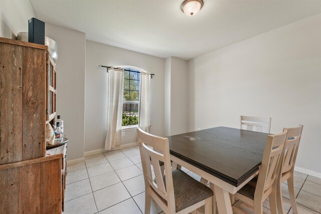 22607 August Crow Dr, Hockley, TX 77447 - dining space with light tile patterned floors and baseboards