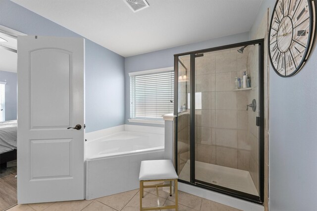 22607 August Crow Dr, Hockley, TX 77447 - full bath featuring tile patterned floors, a stall shower, and plenty of natural light