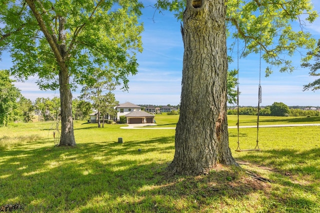 145 Grandview Blvd, Montgomery, TX 77356 - view of green lawn with a garage