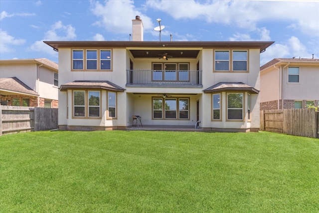 6015 Turner Shadow Ln, Sugar Land, TX 77479 - rear view of property featuring a balcony, a ceiling fan, stucco siding, and a chimney