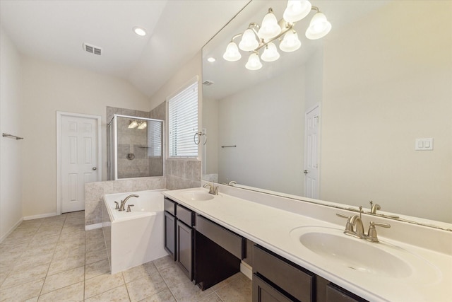 6015 Turner Shadow Ln, Sugar Land, TX 77479 - bathroom with a stall shower, vaulted ceiling, a bath, tile patterned floors, and double vanity