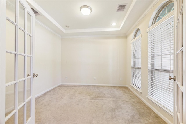 6015 Turner Shadow Ln, Sugar Land, TX 77479 - carpeted empty room featuring a raised ceiling, crown molding, french doors, and baseboards