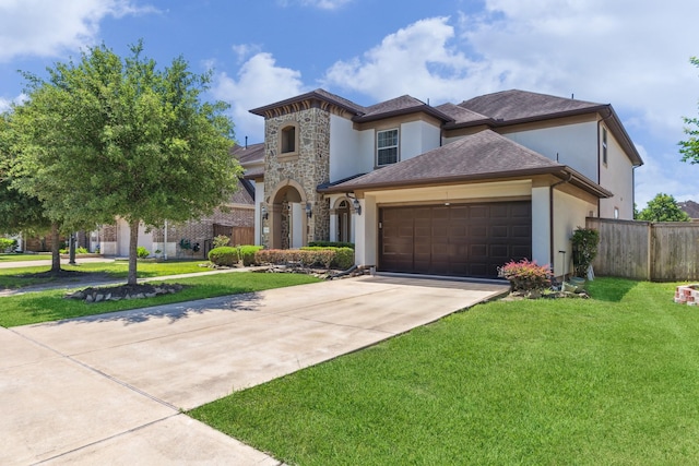 6015 Turner Shadow Ln, Sugar Land, TX 77479 - view of front of property featuring stucco siding, concrete driveway, an attached garage, and stone siding