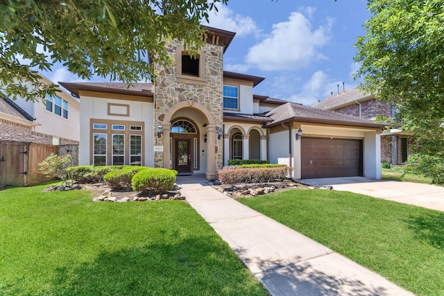 6015 Turner Shadow Ln, Sugar Land, TX 77479 - view of front facade with stucco siding, stone siding, driveway, and a garage