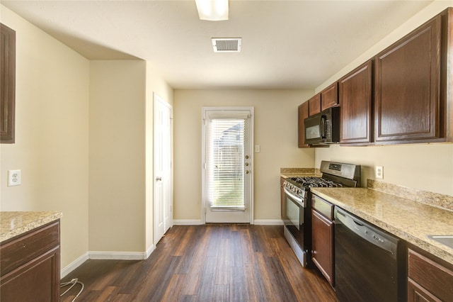 15531 Kiplands Bend Dr, Houston, TX 77014 - kitchen featuring appliances with stainless steel finishes, dark wood-style floors, light countertops, baseboards, and dark brown cabinets