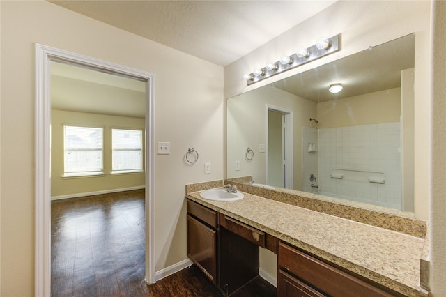 15531 Kiplands Bend Dr, Houston, TX 77014 - bathroom with baseboards, vanity, and wood finished floors