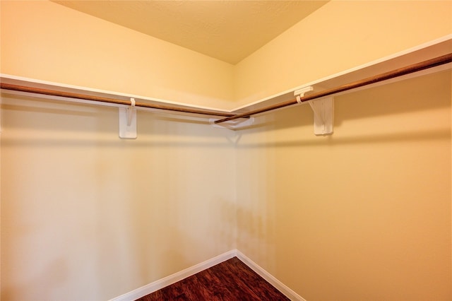 15531 Kiplands Bend Dr, Houston, TX 77014 - spacious closet featuring dark wood-style flooring
