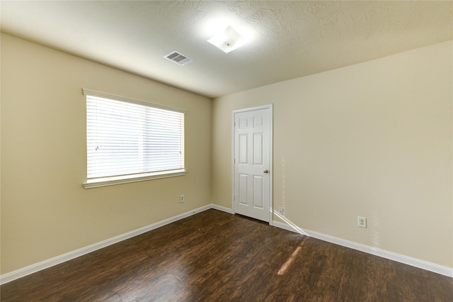 15531 Kiplands Bend Dr, Houston, TX 77014 - empty room featuring dark wood-style floors and baseboards