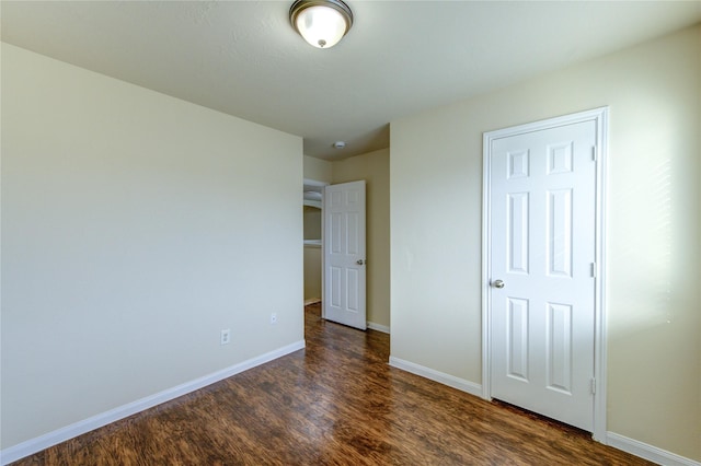 15531 Kiplands Bend Dr, Houston, TX 77014 - unfurnished bedroom featuring dark wood finished floors and baseboards