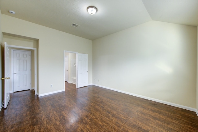 15531 Kiplands Bend Dr, Houston, TX 77014 - unfurnished bedroom with dark wood-style floors, vaulted ceiling, and baseboards