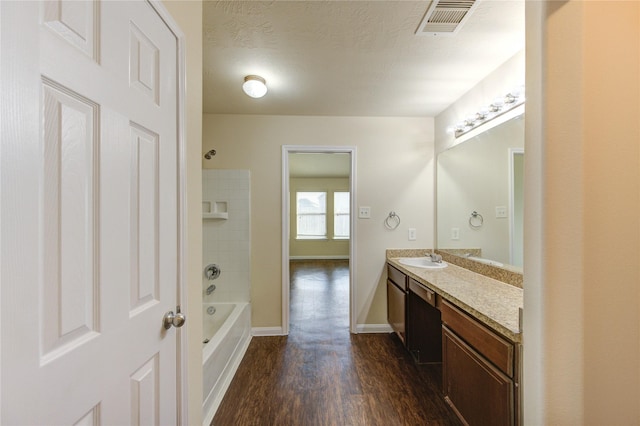 15531 Kiplands Bend Dr, Houston, TX 77014 - bathroom featuring wood finished floors, vanity,  shower combination, and baseboards