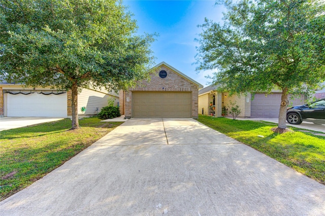 15531 Kiplands Bend Dr, Houston, TX 77014 - obstructed view of property with a front yard and brick siding