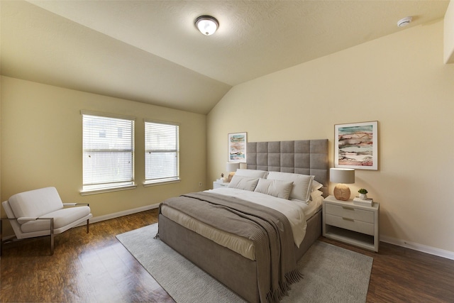 15531 Kiplands Bend Dr, Houston, TX 77014 - bedroom with dark wood-style flooring, baseboards, and vaulted ceiling
