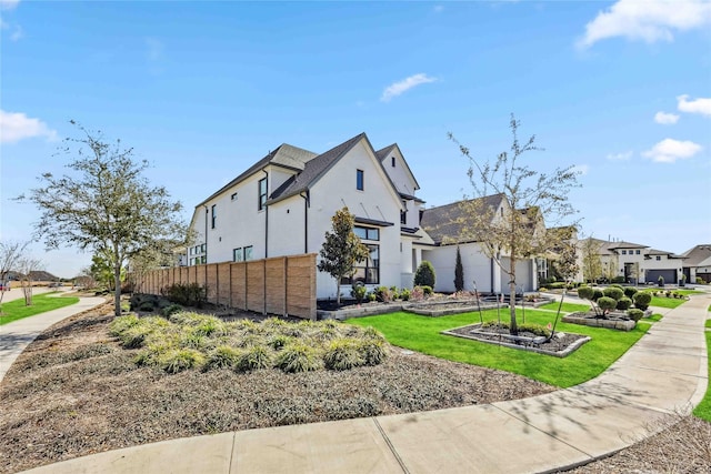 1922 Kessler Point Pl, Katy, TX 77493 - view of side of property with stucco siding, a residential view, and fence