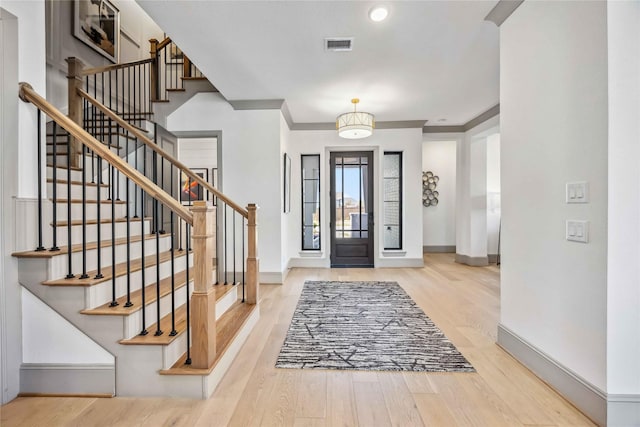 1922 Kessler Point Pl, Katy, TX 77493 - foyer entrance with wood finished floors, baseboards, and stairway