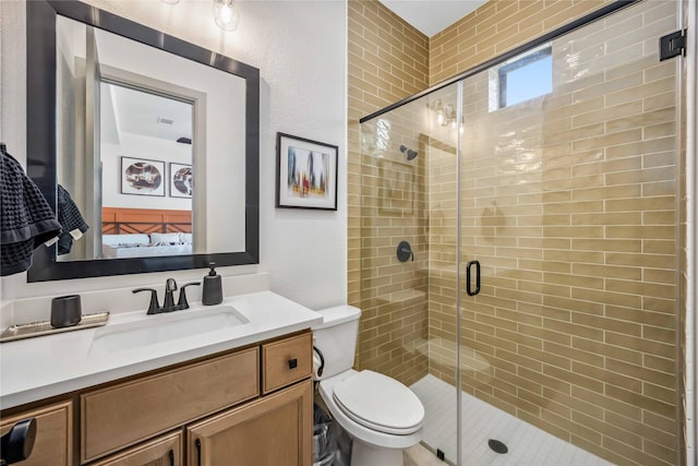 1922 Kessler Point Pl, Katy, TX 77493 - bathroom with connected bathroom, a shower stall, toilet, and vanity