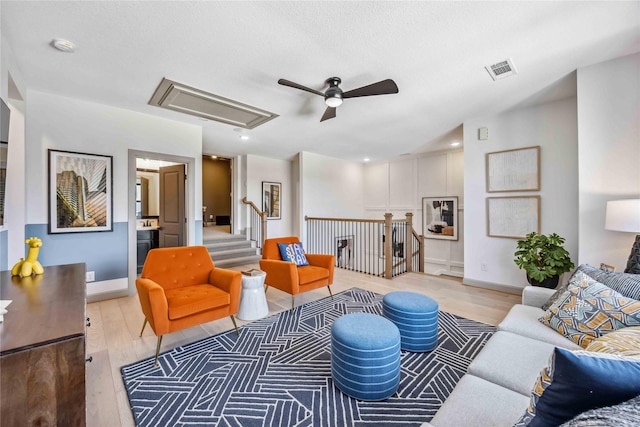 1922 Kessler Point Pl, Katy, TX 77493 - living room featuring a ceiling fan, light wood-style floors, attic access, baseboards, and recessed lighting