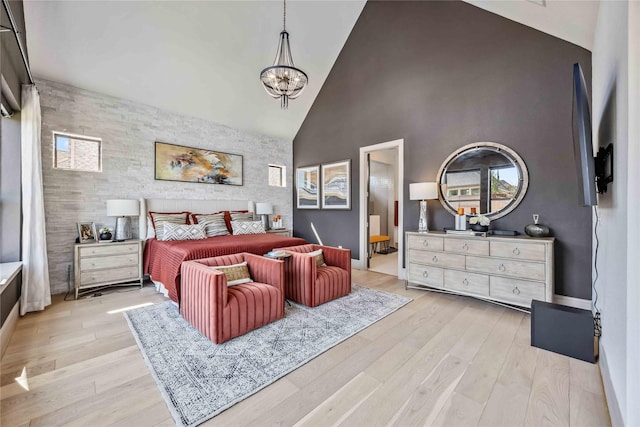 1922 Kessler Point Pl, Katy, TX 77493 - bedroom with high vaulted ceiling, an accent wall, a chandelier, light wood-style flooring, and baseboards