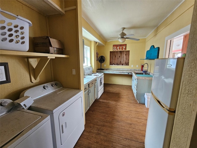 833 Kahla Dr, Crystal Beach, TX 77650 - laundry area with separate washer and dryer, dark wood-style floors, and a ceiling fan