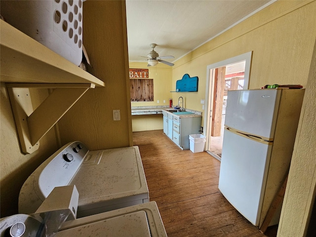 833 Kahla Dr, Crystal Beach, TX 77650 - clothes washing area with wood finished floors, ceiling fan, and washer / dryer